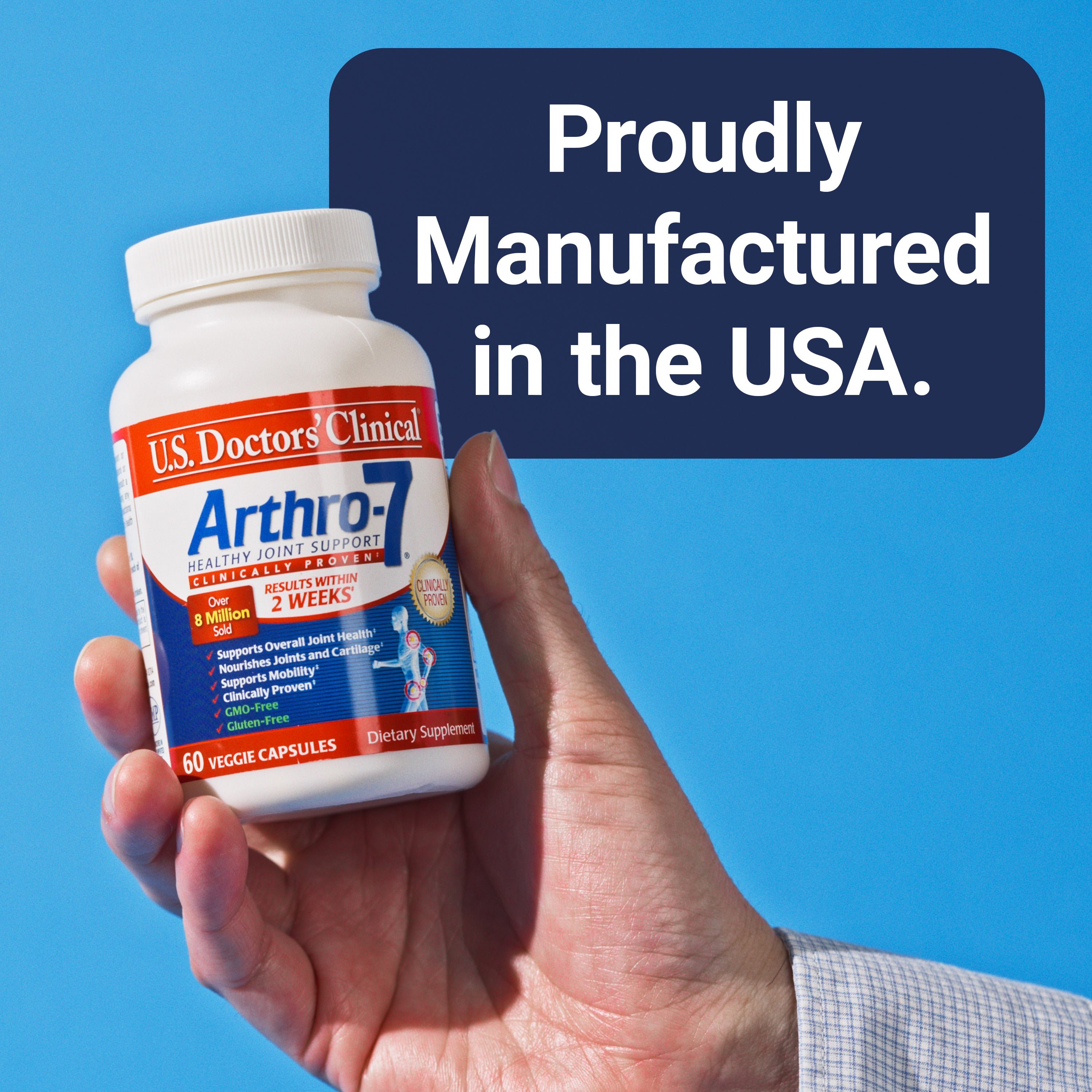 Hand holding a bottle of clinically proven U.S. Doctors' Clinical Arthro-7 that has text about it being proudly manufactured in the USA