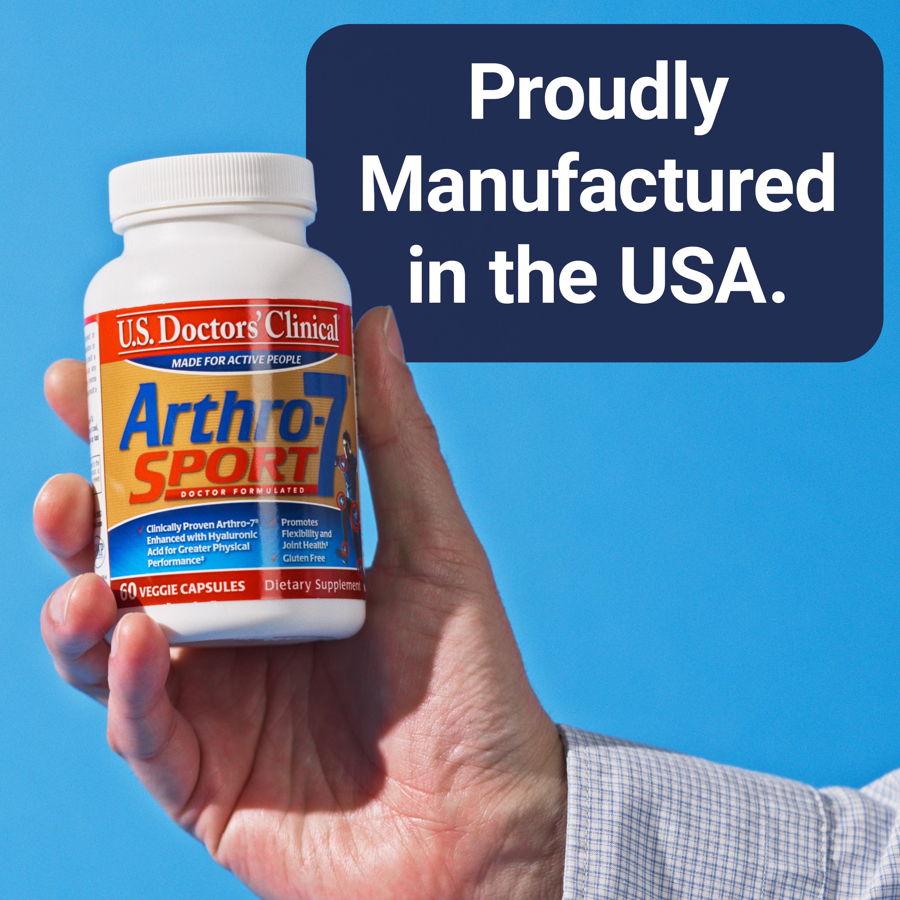Hand holding a bottle of Arthro-7 Sport supplement with 'Proudly Manufactured in the USA' text on a blue background.