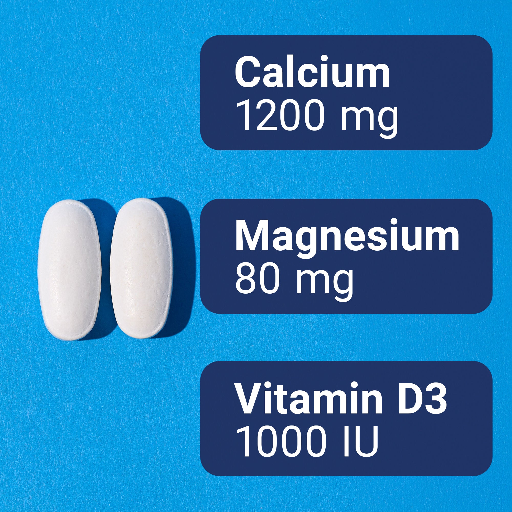 Two white tablets with labels indicating Calcium, Magnesium, and Vitamin D3 on a blue background.