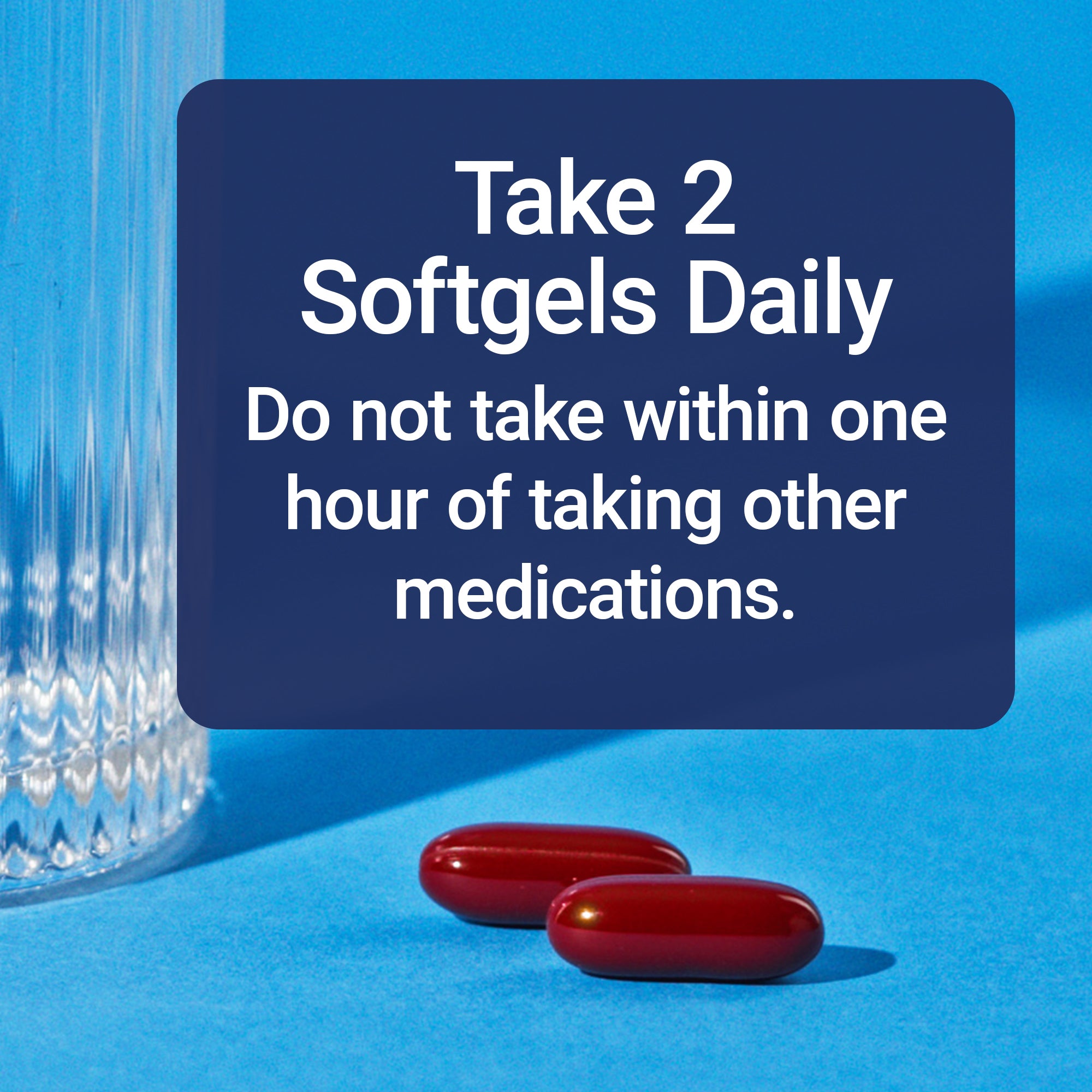 Red softgels with dosage directions on a blue background